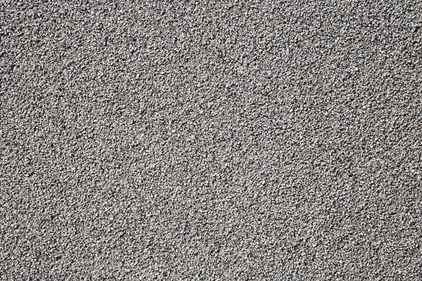 Grey wall made of very small pebble evenly spread