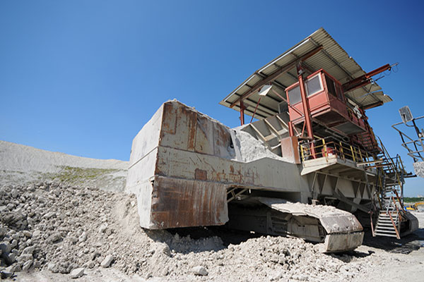 Stone crusher machine in an open pit mine. mining industry